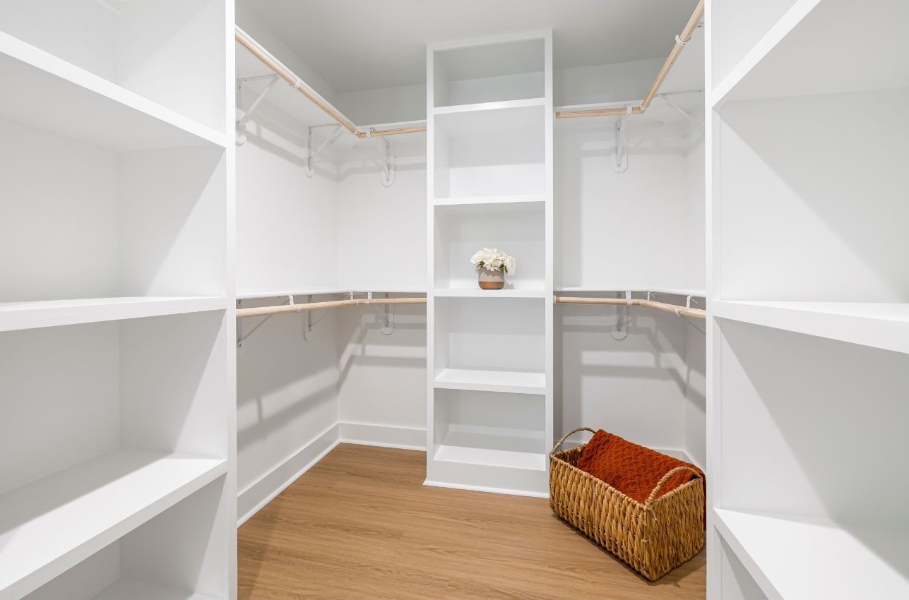 Finished walk-in closet with built-in storage